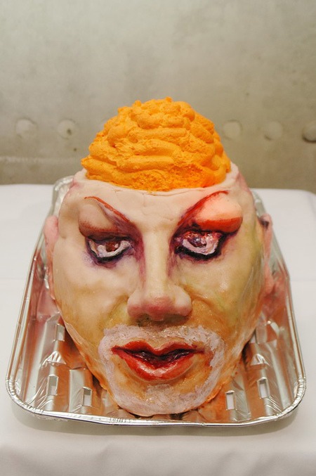 Head-shaped cake with orange cream — detail
