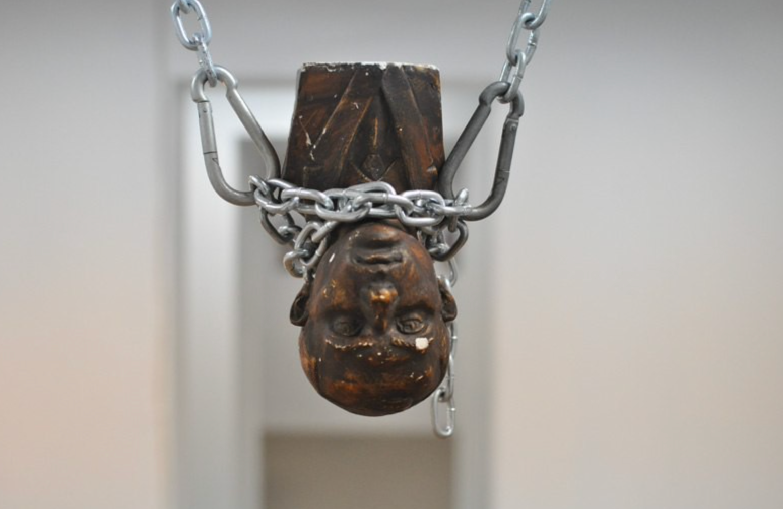 Nazar Sheshuriak — installation with an upside-down bust.